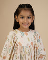 Early Sunday, Belle Dress in Falling Leaves Beige print, made from Printed Viscose Twill fabric, featuring a-line silhouette, bishop sleeves, back button closure, and mid-length, shown in a front view of a model wearing it in a studio setting
