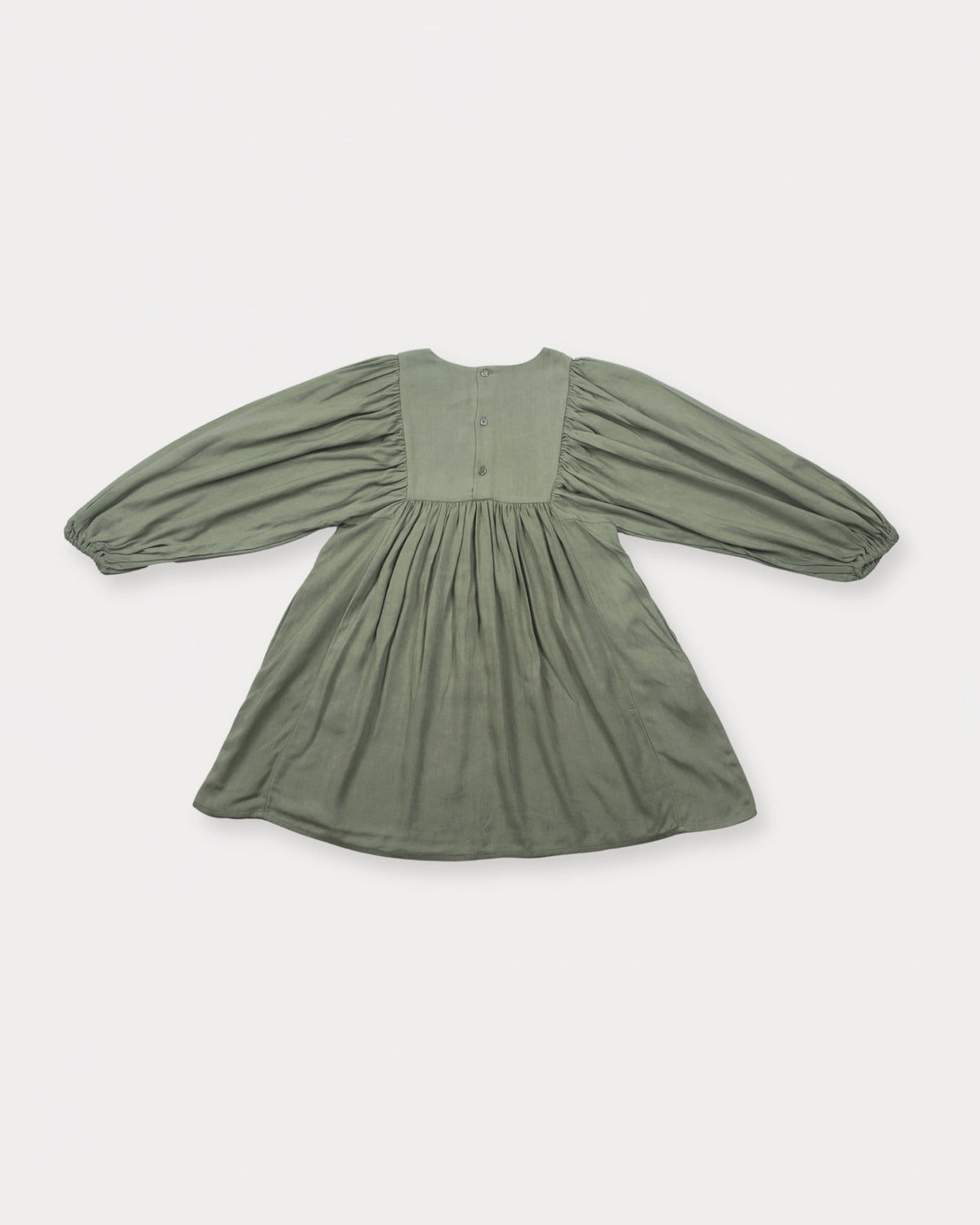 Early Sunday, Belle Dress in Sage Green, made from Viscose Twill fabric, featuring a square yoke bodice with puff sleeves and delicate gathered detailing, shown in a back flat-lay view