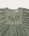 Early Sunday, Belle Dress in Sage Green, made from Viscose Twill fabric, featuring a square yoke bodice with puff sleeves and delicate gathered detailing, shown in a closeup flat-lay view