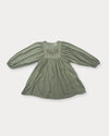 Early Sunday, Belle Dress in Sage Green, made from Viscose Twill fabric, featuring a square yoke bodice with puff sleeves and delicate gathered detailing, shown in a front flat-lay view