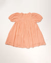 Early Sunday, Beth Dress in Candy Floss color, made from 100% cotton double gauze solid fabric, featuring Puff sleeves, contrast scalloped collar for a vintage touch, shown in a back flat-lay view.