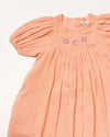 Early Sunday, Beth Dress in Candy Floss color, made from 100% cotton double gauze solid fabric, featuring Puff sleeves, contrast scalloped collar for a vintage touch, shown in a closeup flat-lay view.