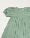 Early Sunday, Beth Dress in Mint color, made from 100% cotton double gauze solid fabric, featuring Puff sleeves, contrast scalloped collar for a vintage touch, shown in a closeup flat-lay view.