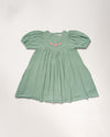 Early Sunday, Beth Dress in Mint color, made from 100% cotton double gauze solid fabric, featuring Puff sleeves, contrast scalloped collar for a vintage touch, shown in a front flat-lay view.