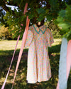 Early Sunday, Beth Dress in Emma Floral Mint color, made from printed cotton cambric fabric, featuring Puff sleeves, contrast scalloped collar for a vintage touch, shown in a close-up of print.