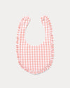 Early Sunday, Bib in Peony checks, made from Cotton Double Gauze fabric, shown in a back flat-lay view