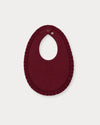 Early Sunday, Bib in Plum, made from Cotton Double Gauze fabric, featuring featuring a soft and comfortable design with an adjustable fit, shown in a back flat-lay view