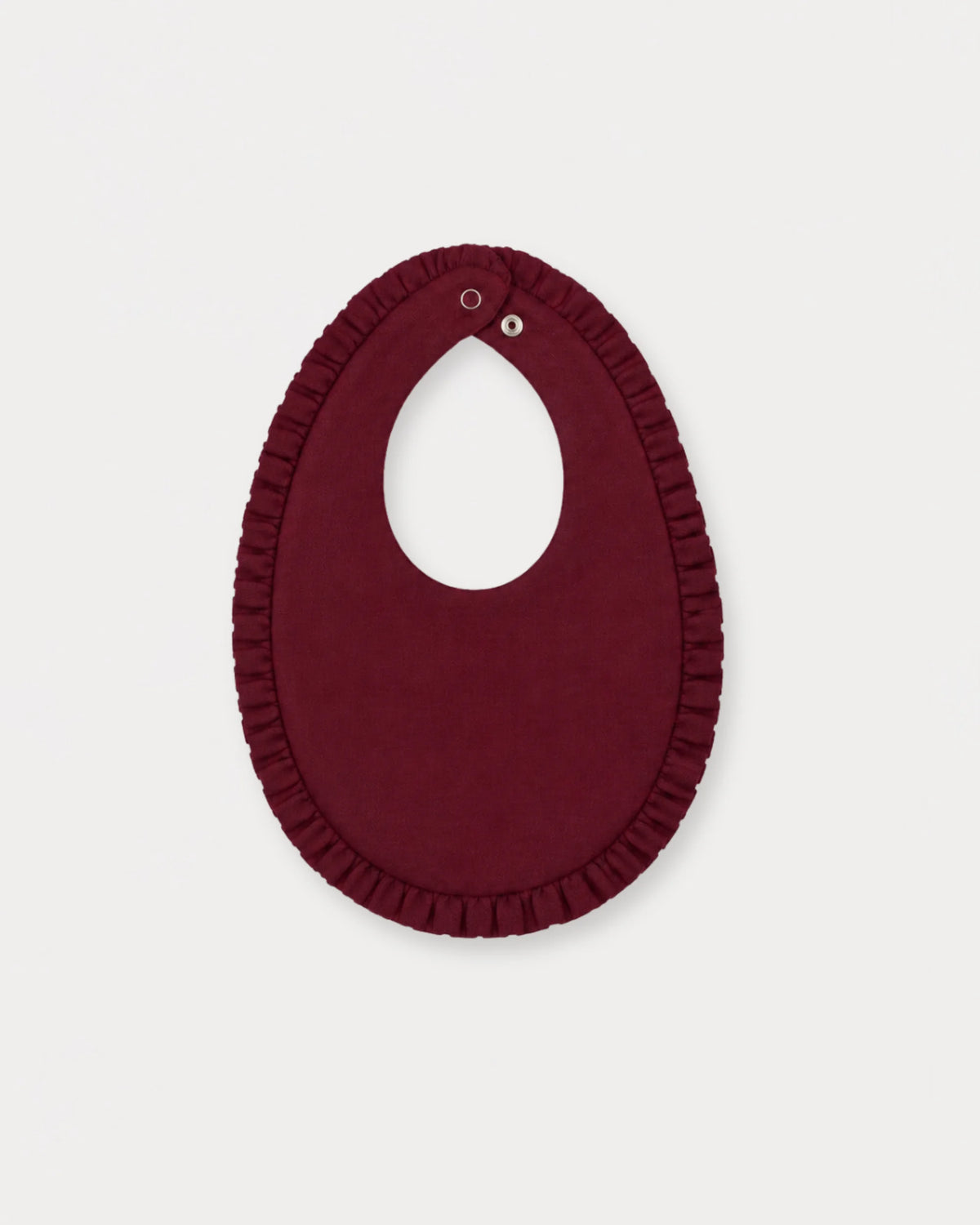 Early Sunday, Bib in Plum, made from Cotton Double Gauze fabric, featuring featuring a soft and comfortable design with an adjustable fit, shown in a back flat-lay view