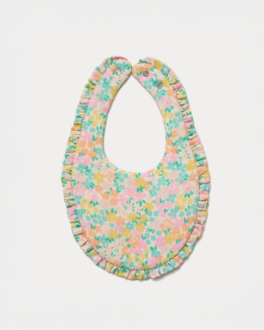 Early Sunday, Bib in Emma Floral Mint color, made from Organic Printed Cotton Double Gauze fabric, shown in a front flat-lay view