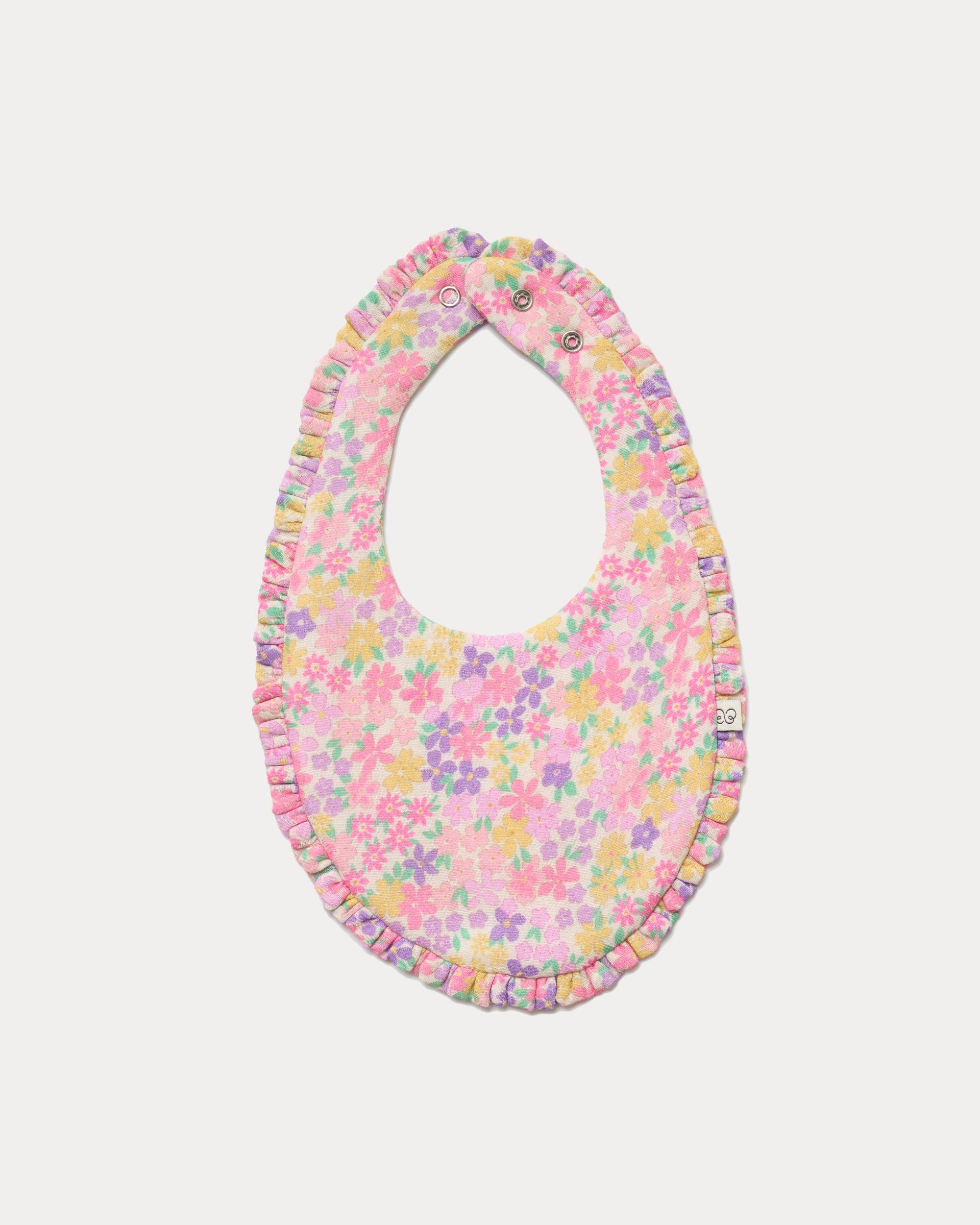 Early Sunday, Bib in Emma Floral Purple color, made from Organic Printed Cotton Double Gauze fabric, shown in a front flat-lay view