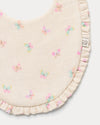 Early Sunday, Bib in Butterflies print, made from Printed Cotton Double Gauze fabric, shown in a closeup flat-lay view