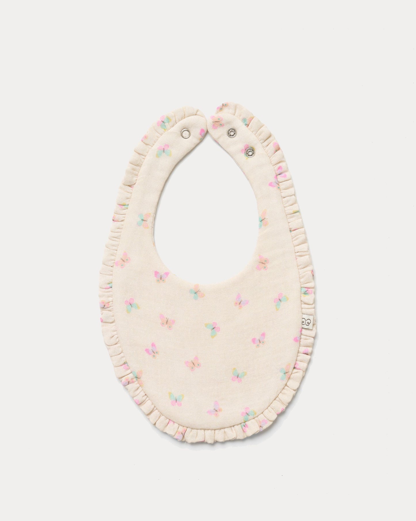 Early Sunday, Bib in Butterflies print, made from Printed Cotton Double Gauze fabric, shown in a front flat-lay view