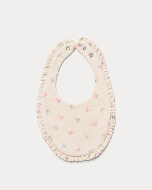 Early Sunday, Bib in Butterflies print, made from Printed Cotton Double Gauze fabric, shown in a front flat-lay view