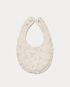 Early Sunday, Bib in Painted Bouquet print, made from Printed Cotton Double Gauze fabric, shown in a back flat-lay view