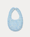 Early Sunday, Bib in Tonal Floral Blue color, made from Printed Cotton Double Gauze fabric, shown in a back flat-lay view