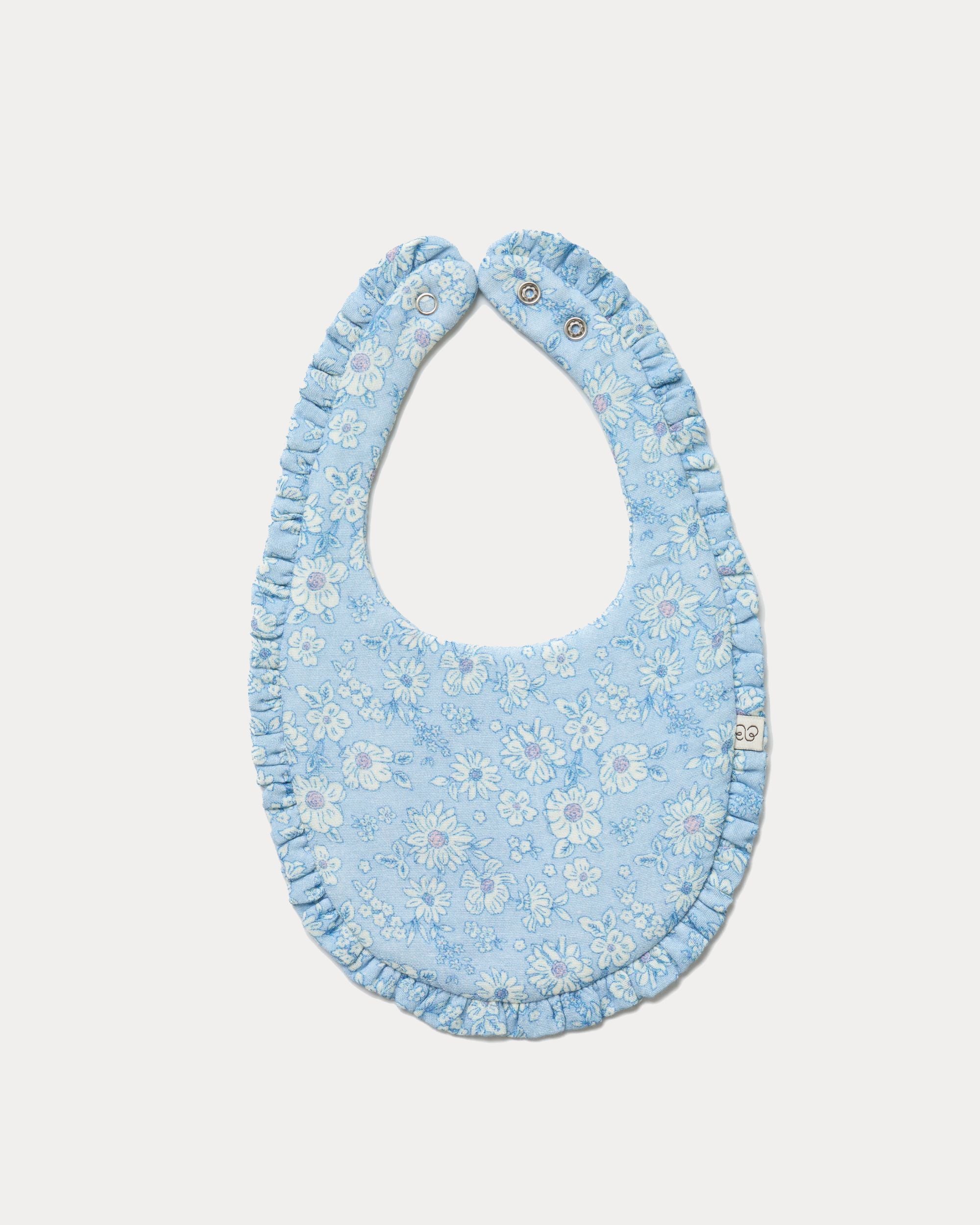 Early Sunday, Bib in Tonal Floral Blue color, made from Printed Cotton Double Gauze fabric, shown in a front flat-lay view