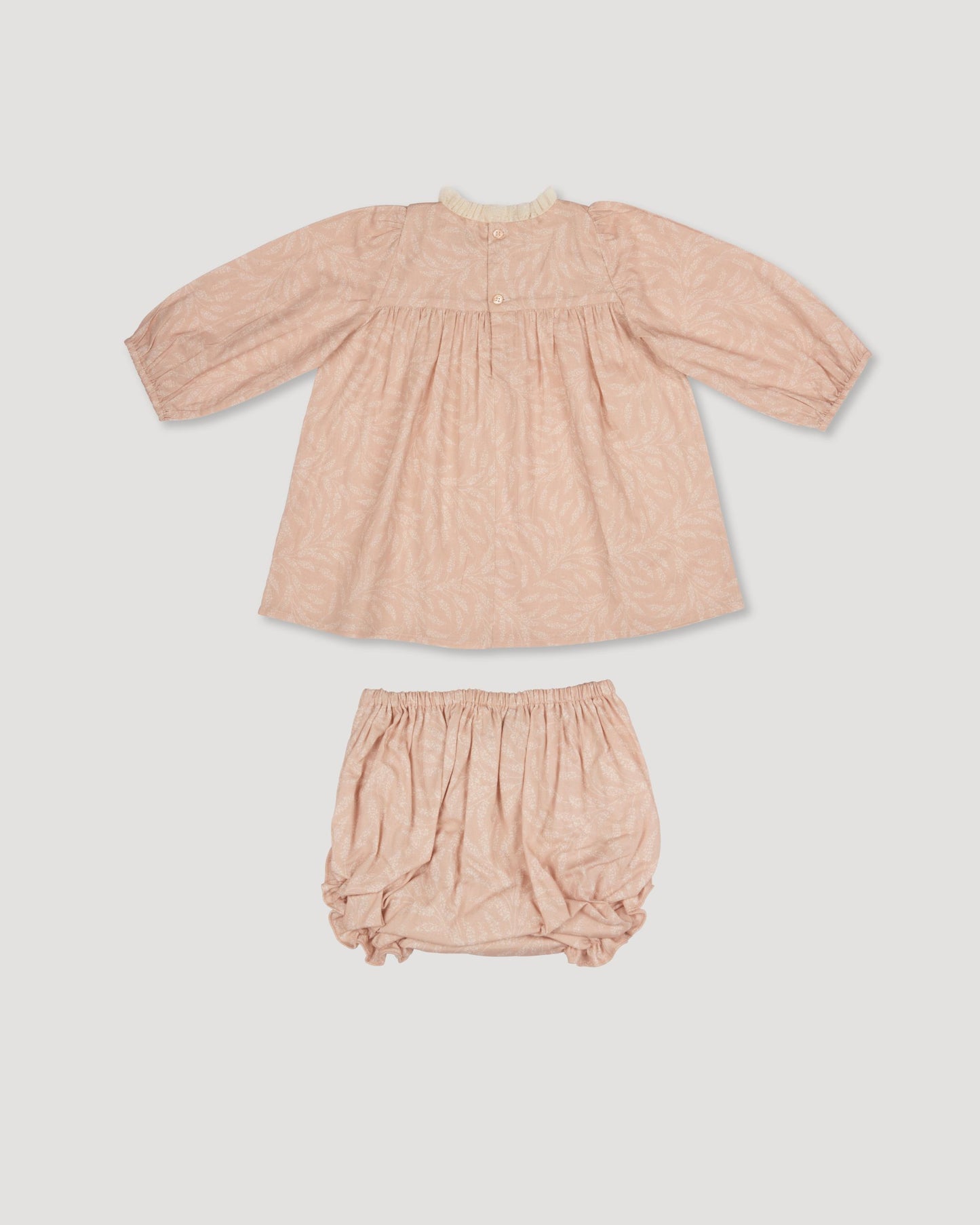 Early Sunday, Billie Baby Dress & Bloomer Set in Feather print, made from Printed 60s Cotton Cambric fabric, featuring long sleeves, lace yoke & a gathered waist with matching bloomers, shown in a back flat-lay view
