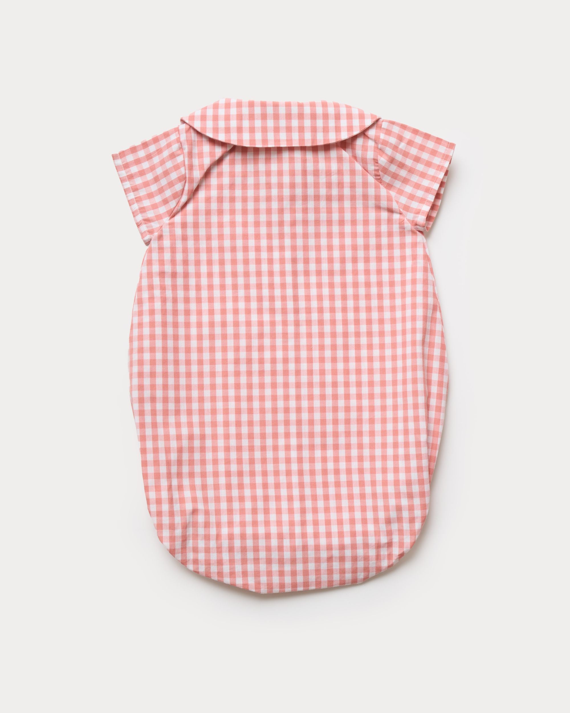 Early Sunday, Bobby Baby Romper in Peony color, made from 100% Cotton Gingham Check fabric, featuring short sleeves with peter pan collar, shown in a back flat-lay view