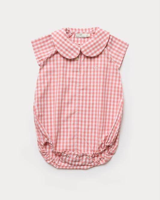 Early Sunday, Bobby Baby Romper in Peony color, made from 100% Cotton Gingham Check fabric, featuring short sleeves with peter pan collar, shown in a front flat-lay view