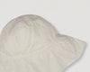 Early Sunday, Bonnie Baby Sun Hat in Ivory color, made from All-Over Eyelet Embroidered Cotton Schifflie fabric, featuring wide brim for sun protection, designed to be lightweight and comfortable for all-day wear, shown in a closeup flat-lay view