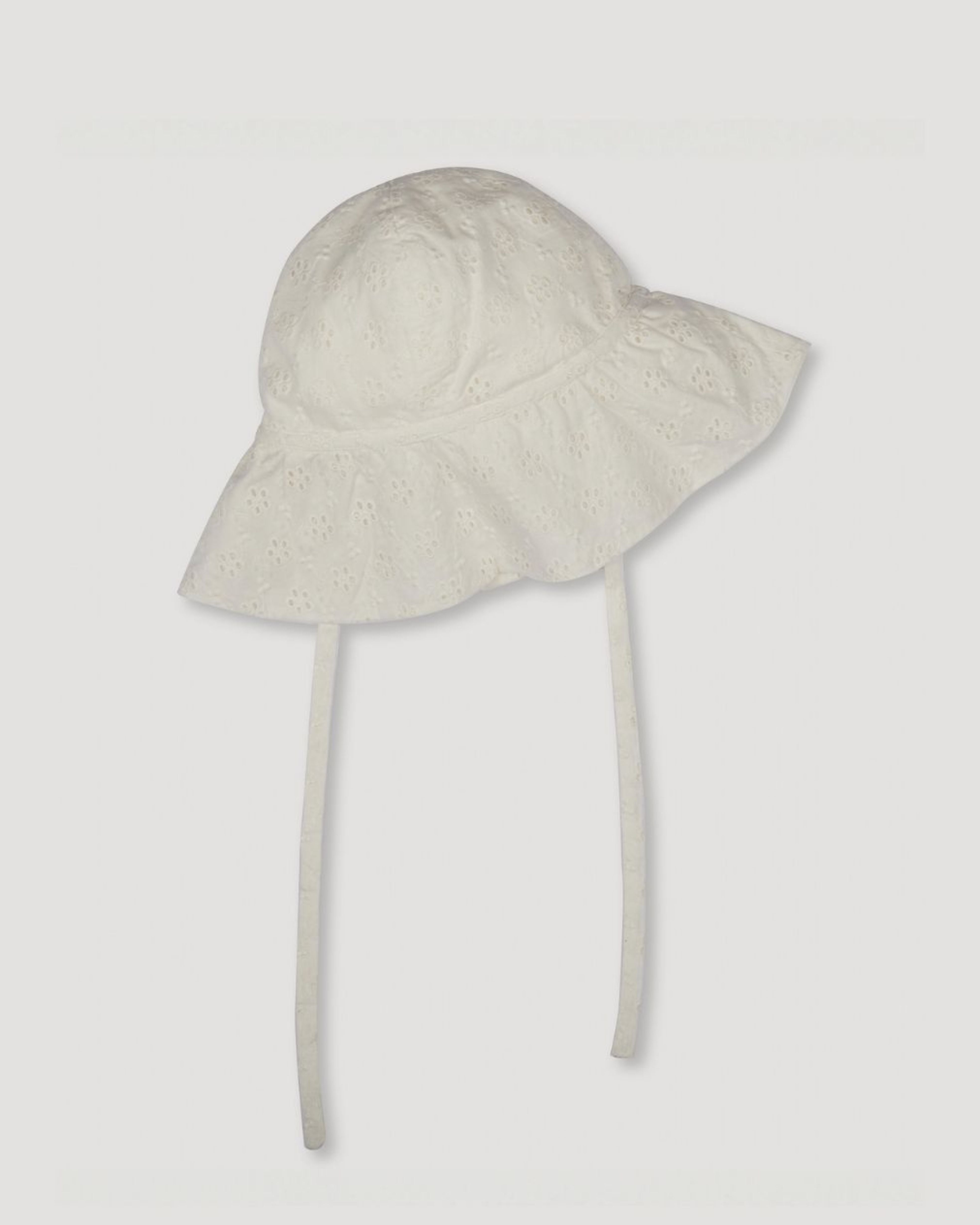 Early Sunday, Bonnie Baby Sun Hat in Ivory color, made from All-Over Eyelet Embroidered Cotton Schifflie fabric, featuring wide brim for sun protection, designed to be lightweight and comfortable for all-day wear, shown in a front flat-lay view