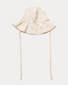 Early Sunday, Bonnie Hat Cap in Painted Bouquet print, made from 70% Cotton, 30% Linen fabric, shown in a front flat-lay view with wide brim and tie straps
