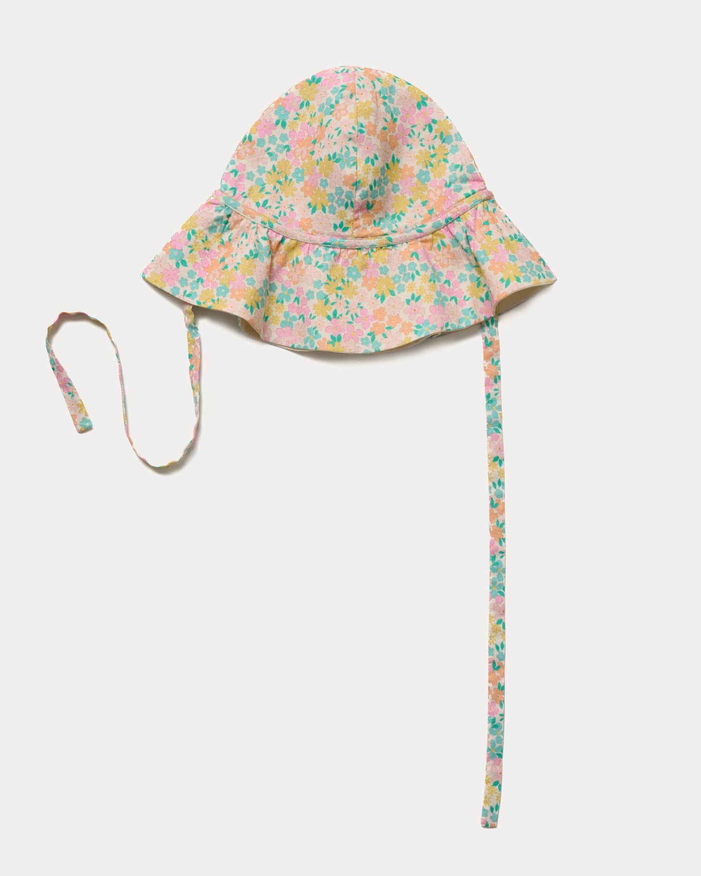 Early Sunday, Bonnie Hat Cap in Emma Floral Mint color, made from Organic Printed Cotton Cambric fabric, shown in an angled view with wide brim and tie straps