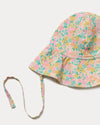 Early Sunday, Bonnie Hat Cap in Emma Floral Mint color, made from Organic Printed Cotton Cambric fabric, shown in a closeup flat-lay view