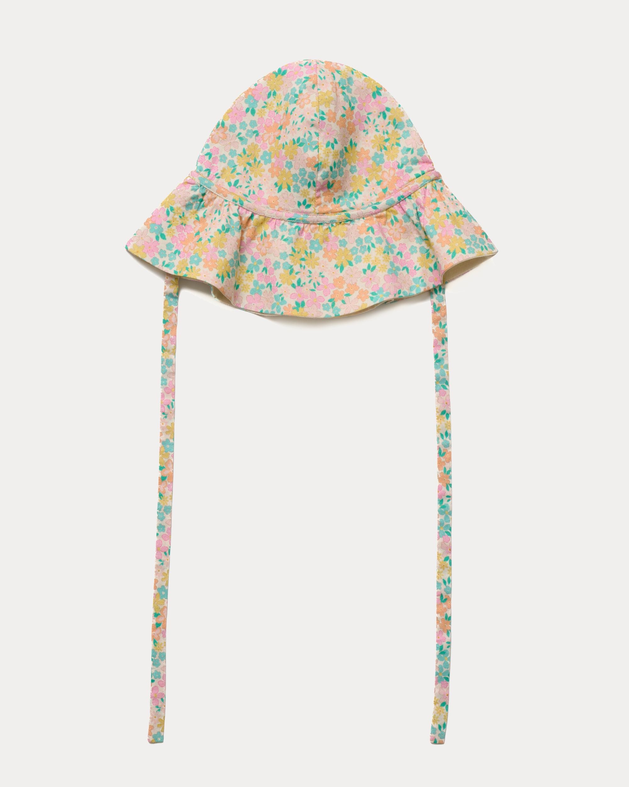 Early Sunday, Bonnie Hat Cap in Emma Floral Mint color, made from Organic Printed Cotton Cambric fabric, shown in a front flat-lay view with wide brim and tie straps