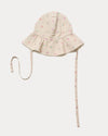 Early Sunday, Bonnie Hat Cap in Butterflies print, made from Printed Tiny Swiss Dobby fabric, shown in an angled view with wide brim and tie straps