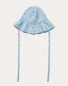 Early Sunday, Bonnie Hat Cap in Tonal Floral Blue color, made from Printed Tiny Swiss Dobby fabric, shown in a front flat-lay view with wide brim and tie straps