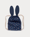 Early Sunday, Bunny Bag in Ditsy Bouquet Navy Blue, made from Printed Cotton Satin fabric, featuring a bunny-ear design with a drawstring closure, shown in a back flat-lay view