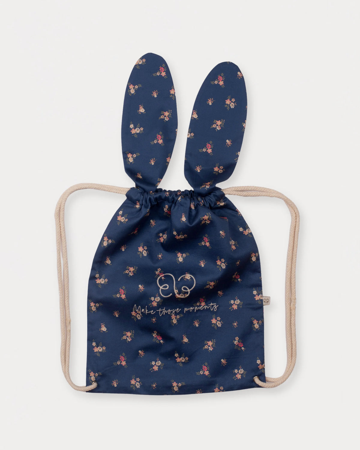 Early Sunday, Bunny Bag in Ditsy Bouquet Navy Blue, made from Printed Cotton Satin fabric, featuring a bunny-ear design with a drawstring closure, shown in a front flat-lay view