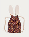 Early Sunday, Bunny Bag in Garden Flowers Plum, made from Printed Cotton Satin fabric, featuring a bunny-ear design with a drawstring closure, shown in a back flat-lay view