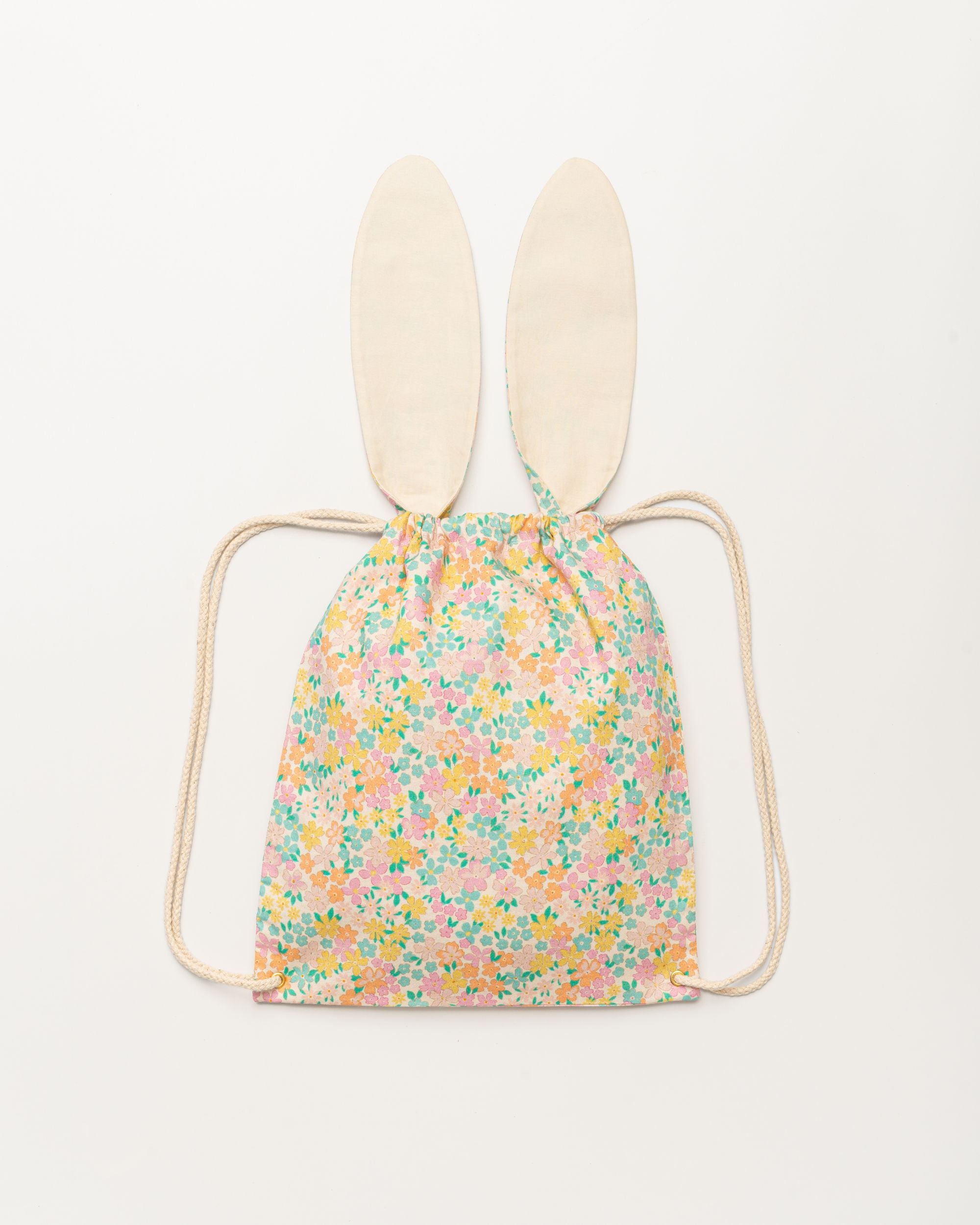 Early Sunday, Bunny Drawstring Backpack in Emma Floral Mint color, made from Organic Printed Cotton Cambric fabric, featuring a bunny-ear design with a drawstring closure, shown in a back flat-lay view