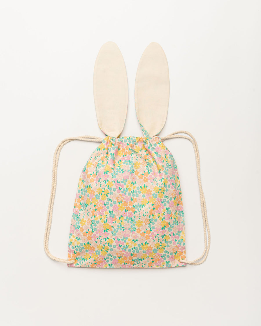 Early Sunday, Bunny Drawstring Backpack in Emma Floral Mint color, made from Organic Printed Cotton Cambric fabric, featuring a bunny-ear design with a drawstring closure, shown in a back flat-lay view