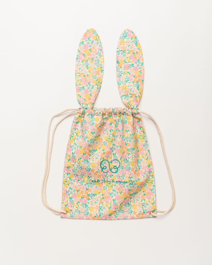 Early Sunday, Bunny Drawstring Backpack in Emma Floral Mint color, made from Organic Printed Cotton Cambric fabric, featuring a bunny-ear design with a drawstring closure, shown in a front flat-lay view
