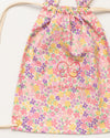Early Sunday, Bunny Drawstring Backpack in Emma Floral Purple color, made from Organic Printed Cotton Cambric fabric, featuring a bunny-ear design with a drawstring closure, shown in a closeup flat-lay view