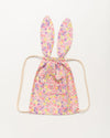 Early Sunday, Bunny Drawstring Backpack in Emma Floral Purple color, made from Organic Printed Cotton Cambric fabric, featuring a bunny-ear design with a drawstring closure, shown in a front flat-lay view