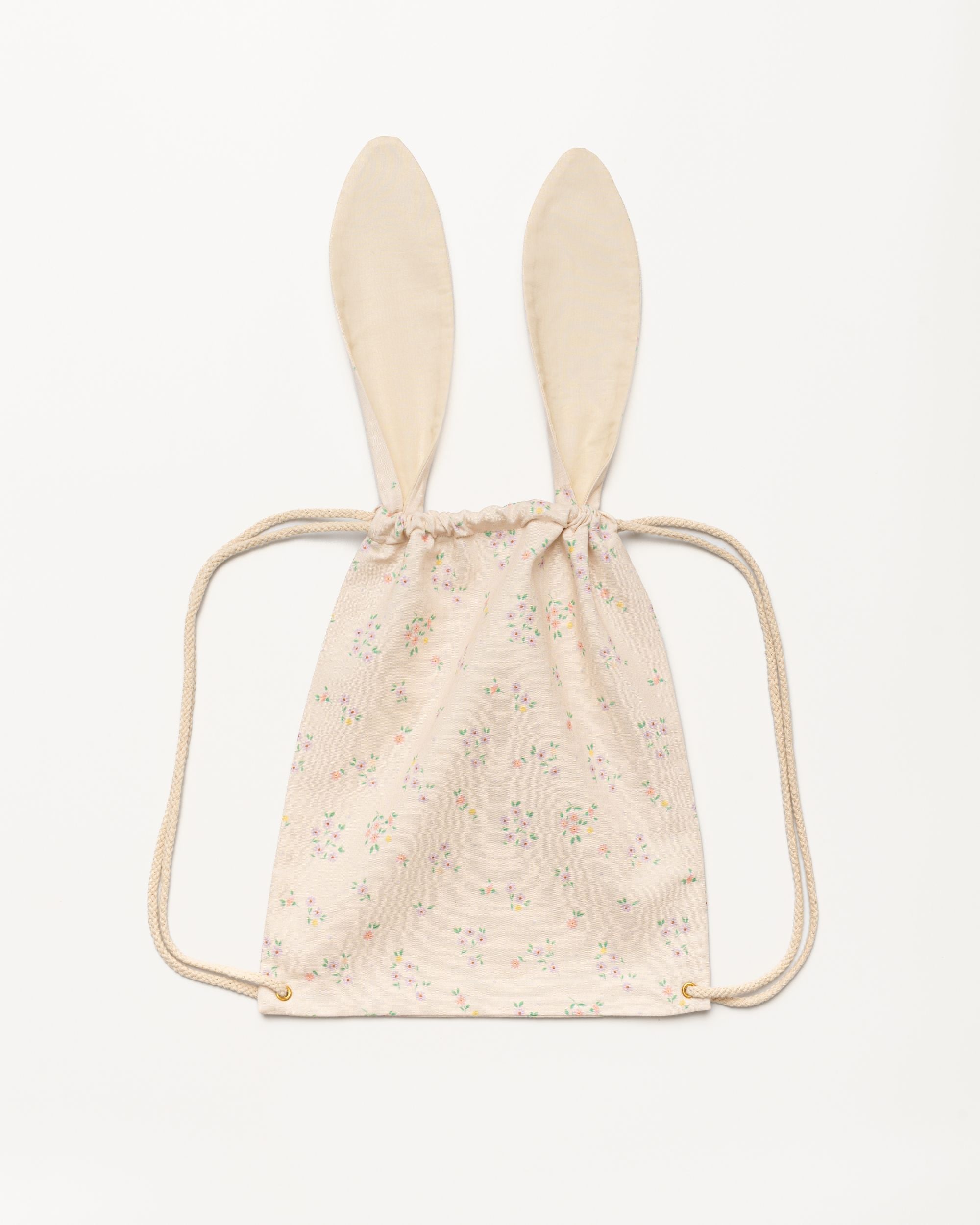 Early Sunday, Bunny Drawstring Backpack in Painted Bouquet print, made from Printed 70% Cotton, 30% Linen fabric, featuring a bunny-ear design with a drawstring closure, shown in a back flat-lay view