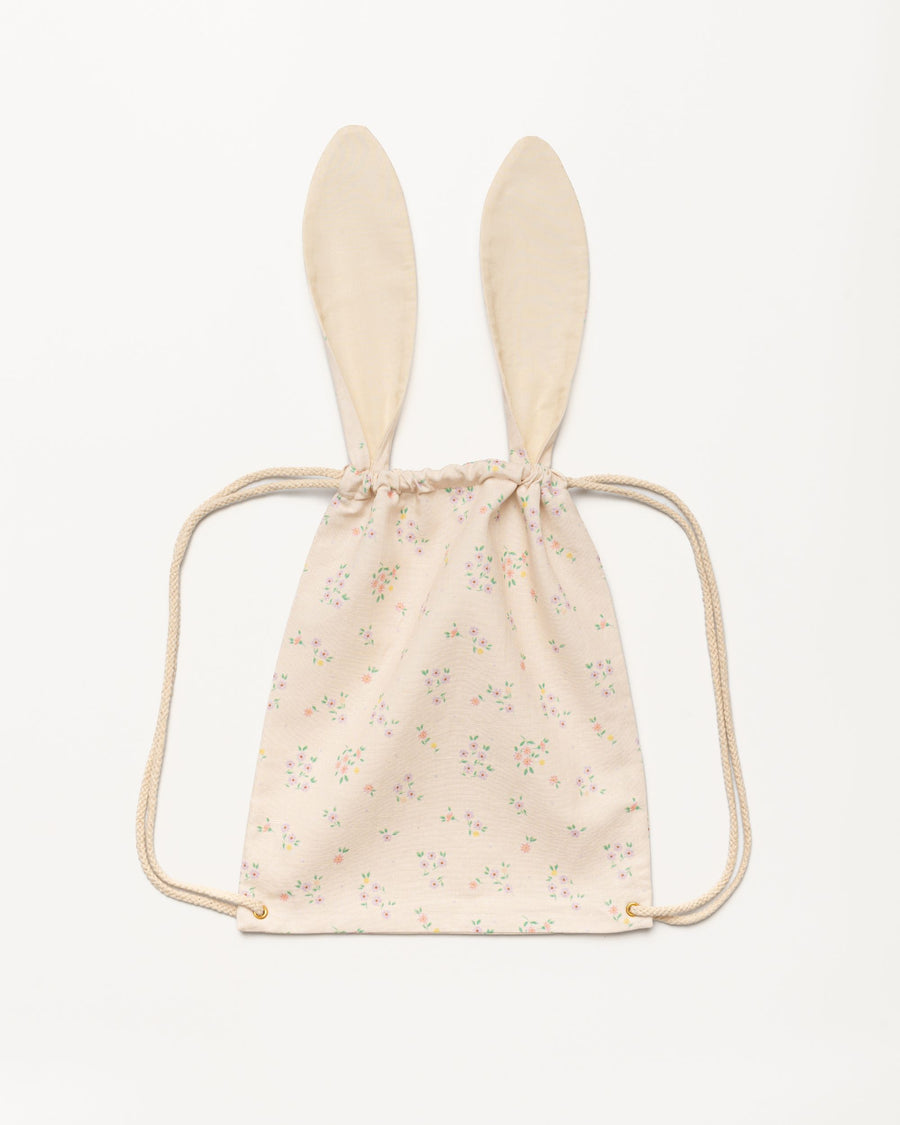 Early Sunday, Bunny Drawstring Backpack in Painted Bouquet print, made from Printed 70% Cotton, 30% Linen fabric, featuring a bunny-ear design with a drawstring closure, shown in a back flat-lay view