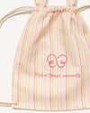 Early Sunday, Bunny Drawstring Backpack in Pink Stripes print, made from Printed 70% Cotton, 30% Linen fabric, featuring a bunny-ear design with a drawstring closure, shown in a closeup flat-lay view