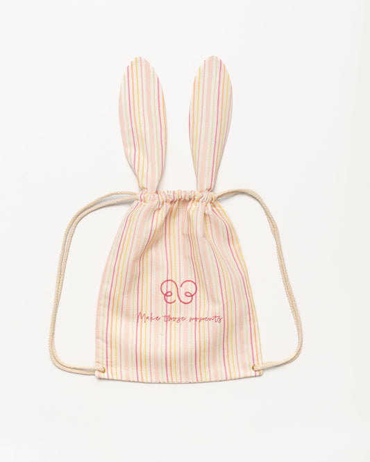 Early Sunday, Bunny Drawstring Backpack in Pink Stripes print, made from Printed 70% Cotton, 30% Linen fabric, featuring a bunny-ear design with a drawstring closure, shown in a front flat-lay view