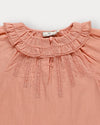 Early Sunday, Cécile Blouse in Blush, made from Cotton Swiss Dobby fabric, featuring a relaxed silhouette with gathered sleeves and delicate detailing, shown in a closeup flat-lay view