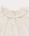 Early Sunday, Cécile Blouse in Ecru, made from Cotton Swiss Dobby fabric, featuring a relaxed silhouette with gathered sleeves and delicate detailing, shown in a closeup flat-lay view