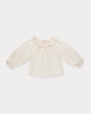 Early Sunday, Cécile Blouse in Ecru, made from Cotton Swiss Dobby fabric, featuring a relaxed silhouette with gathered sleeves and delicate detailing, shown in a front flat-lay view
