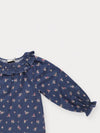 Early Sunday, Cécile Blouse in Ditsy Bouquet Navy, made from Printed Cotton Satin fabric, featuring a relaxed silhouette with gathered sleeves and delicate detailing, shown in a closeup flat-lay view