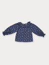 Early Sunday, Cécile Blouse in Ditsy Bouquet Navy, made from Printed Cotton Satin fabric, featuring a relaxed silhouette with gathered sleeves and delicate detailing, shown in a front flat-lay view
