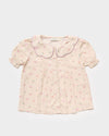 Early Sunday, Camelia Blouse in Butterfly Print color, made from printed cotton tiny swiss dobby fabric, featuring short sleeves with peter pan collar, shown in a front flat-lay view