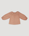 Early Sunday, Cecilia Blouse in Earthy Pink color, made from Cotton Swiss Dobby fabric, featuring relaxed fit, frill neckline, long sleeves with elasticated cuffs, and MOP buttons, shown in a back flat-lay view